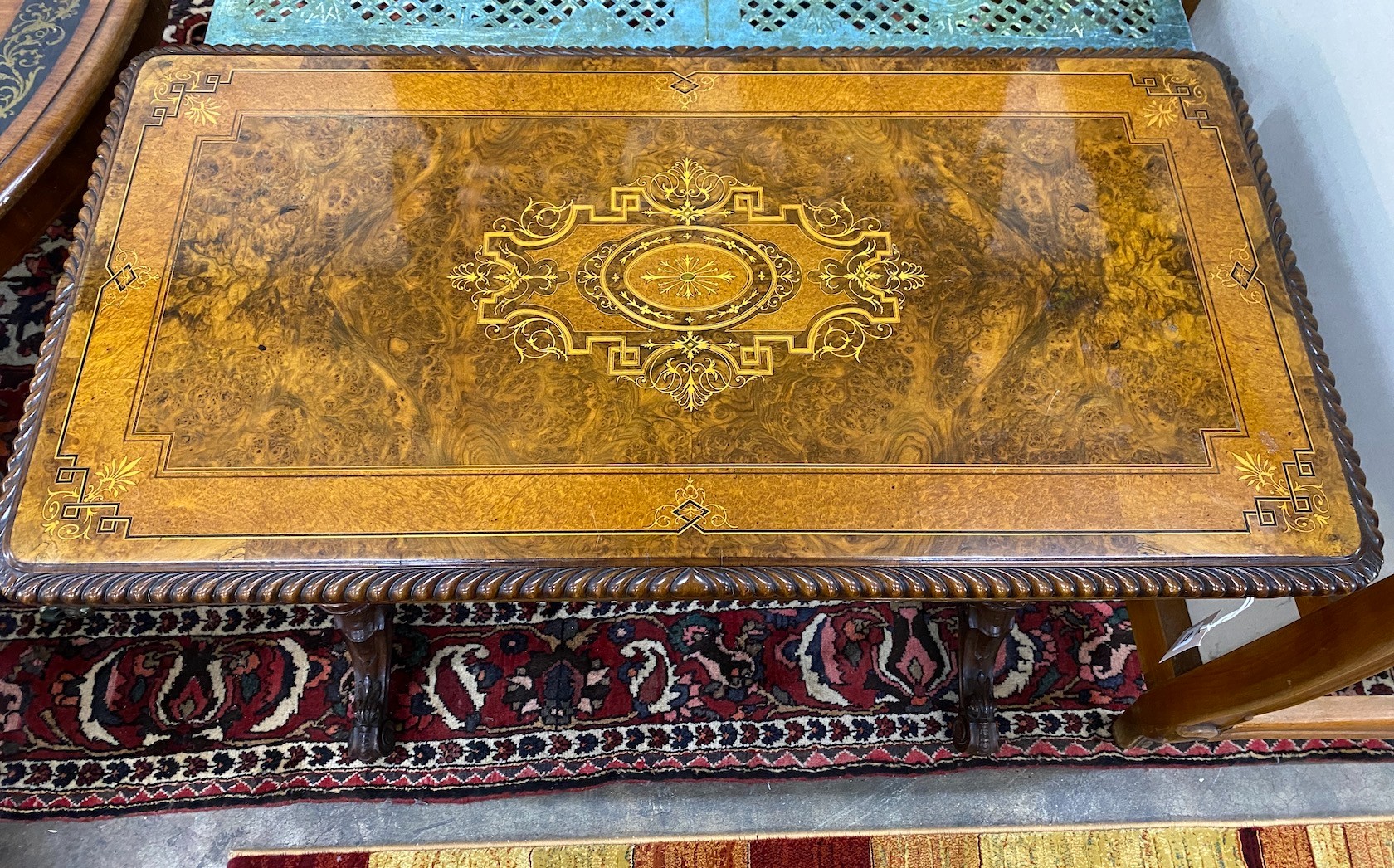 A late Victorian marquetry inlaid burr walnut rectangular folding card table, width 97cm, depth 50cm, height 74cm